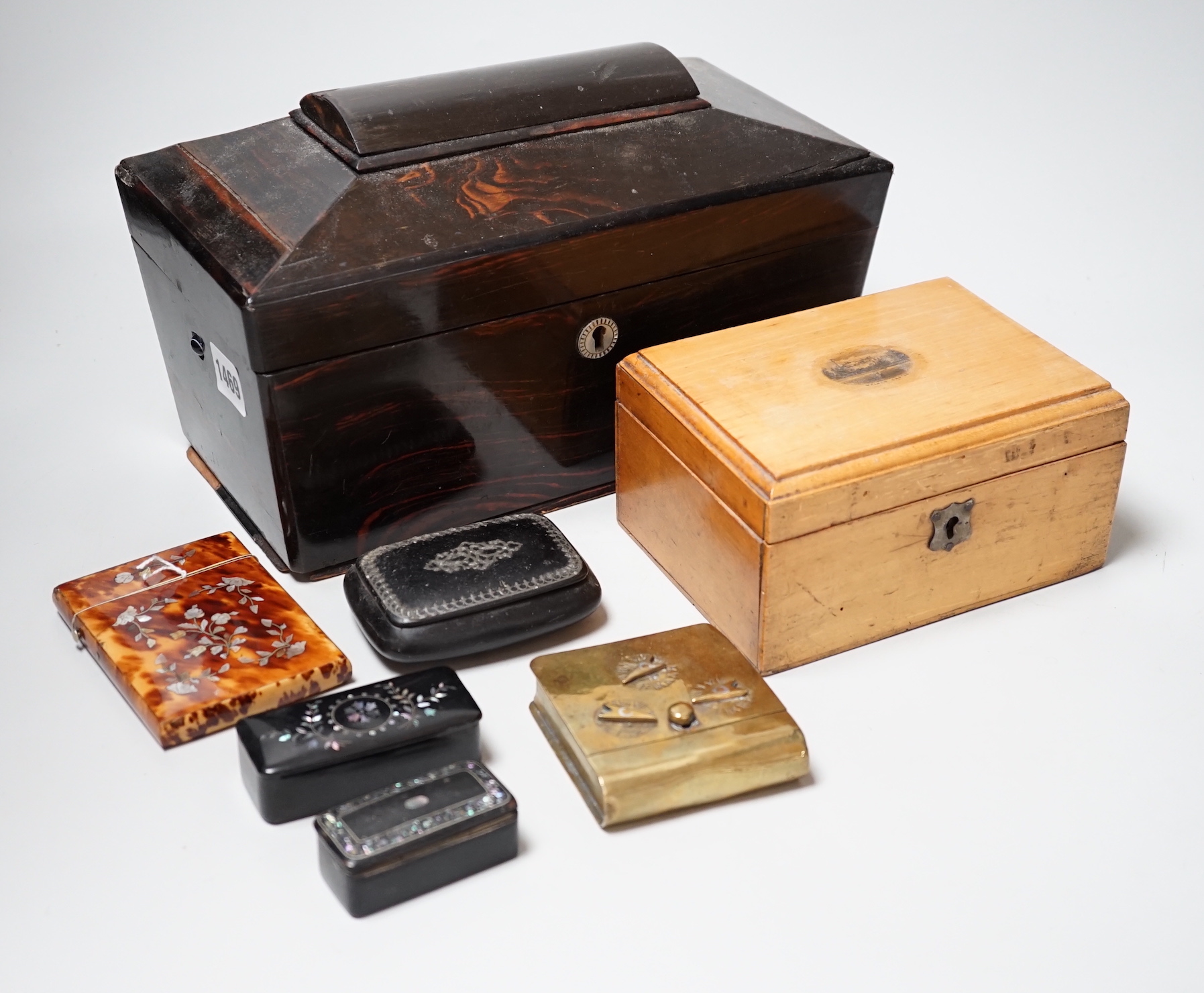 A Victorian Coromandel box containing a Victorian tortoiseshell mother-of-pearl inlaid card case, a Mauchline ware box and other boxes